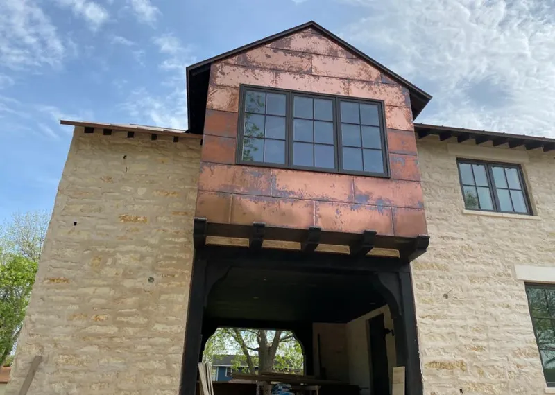 Copper metal panel facade on a stone building for Metal Roof Coating in San Jacinto